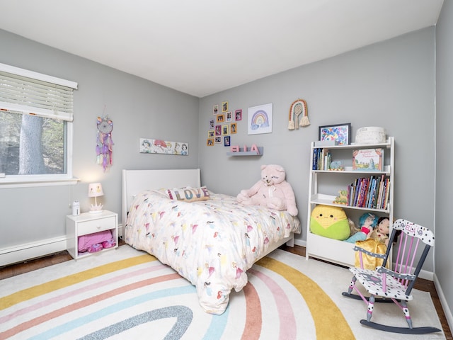 bedroom featuring baseboard heating and baseboards