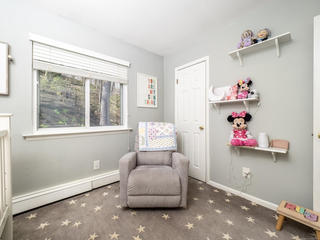 living area featuring a baseboard radiator, baseboards, and carpet flooring