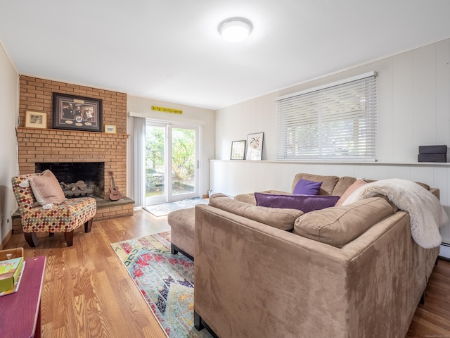 living room featuring a fireplace and wood finished floors