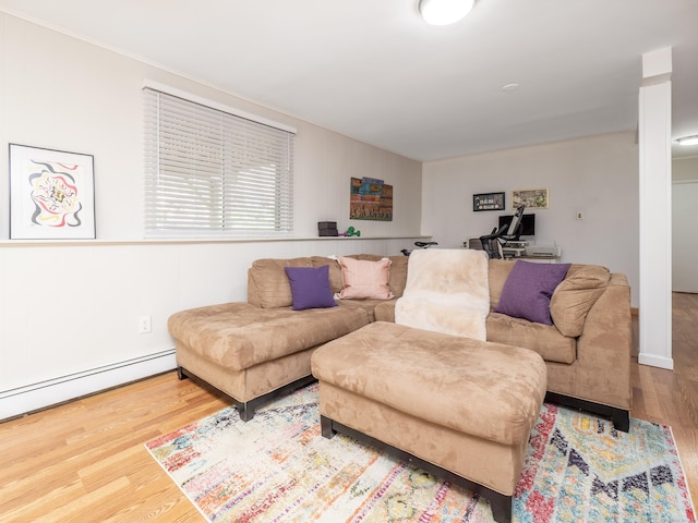 living area featuring wood finished floors and baseboard heating