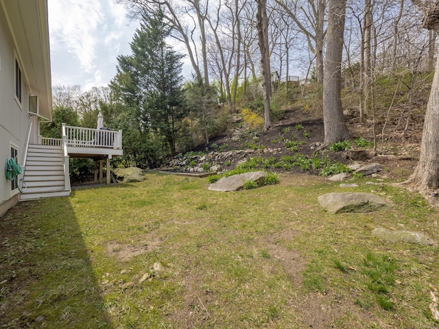 view of yard with stairway and a wooden deck