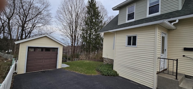 detached garage with aphalt driveway
