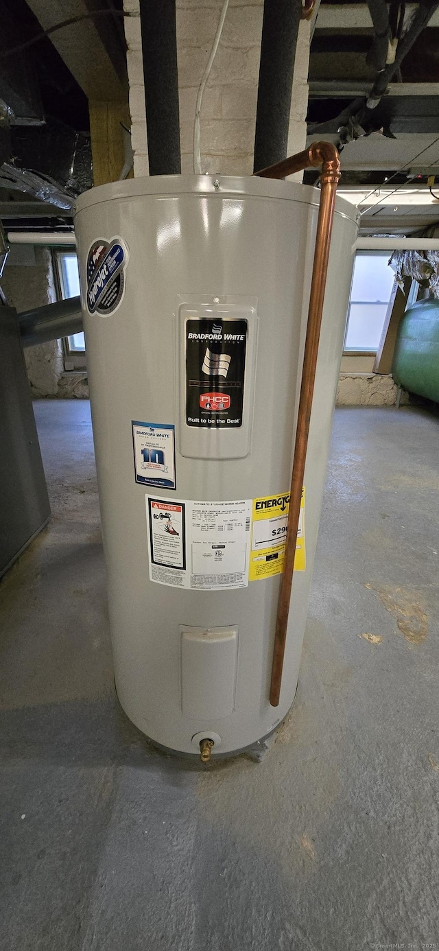 utility room featuring electric water heater