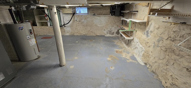 below grade area featuring water heater