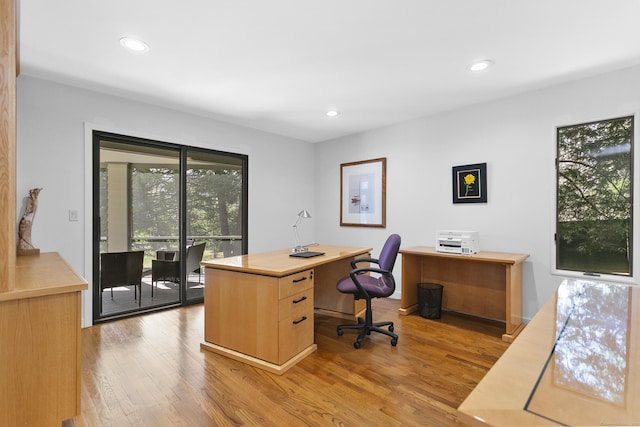 office with recessed lighting and wood finished floors