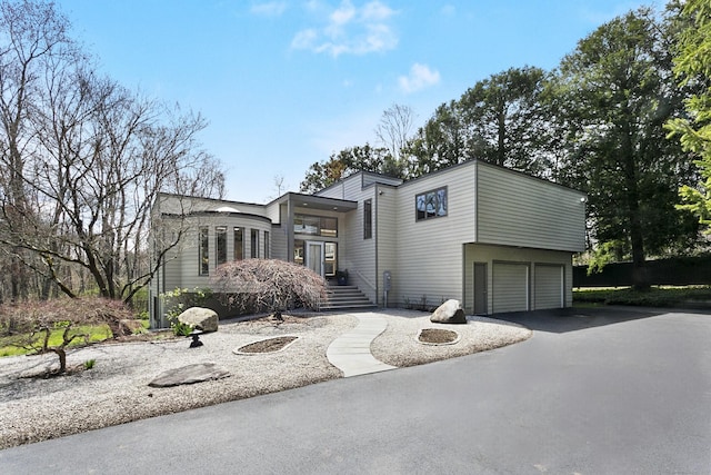 view of front of home featuring an attached garage and driveway
