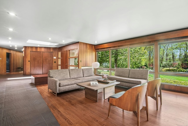 71 Boulderol Rd, Stamford, CT 06903 - living area with a skylight, wood walls, and recessed lighting