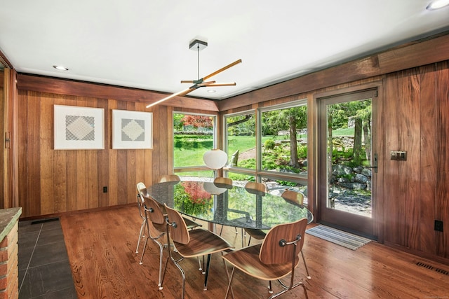 71 Boulderol Rd, Stamford, CT 06903 - dining space featuring wood walls, ceiling fan, wood finished floors, and baseboards