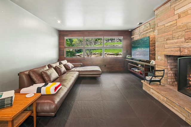 71 Boulderol Rd, Stamford, CT 06903 - living room with a stone fireplace, recessed lighting, and wood walls