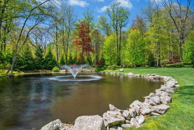71 Boulderol Rd, Stamford, CT 06903 - view of home's community with a water view, a wooded view, and a lawn