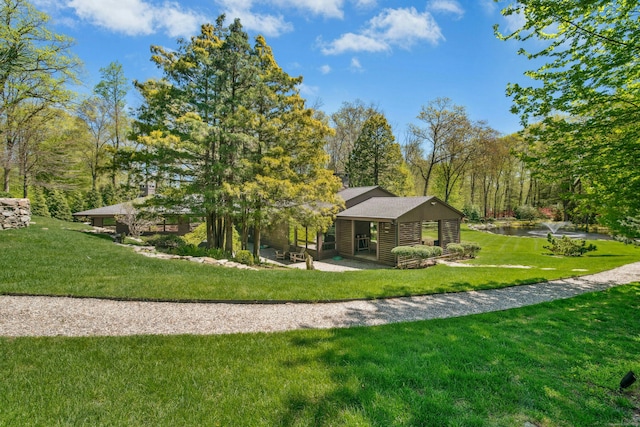 71 Boulderol Rd, Stamford, CT 06903 - view of home's exterior with a yard and a patio