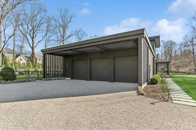 garage with a garage and fence
