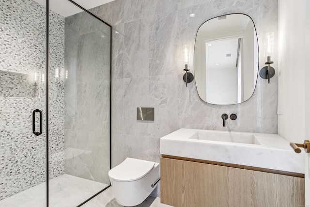 bathroom with tile walls, a stall shower, toilet, and vanity