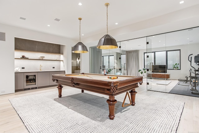 playroom featuring beverage cooler, light wood finished floors, billiards, recessed lighting, and a sink