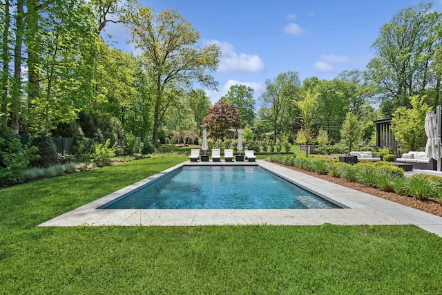 view of pool featuring outdoor lounge area and view of scattered trees