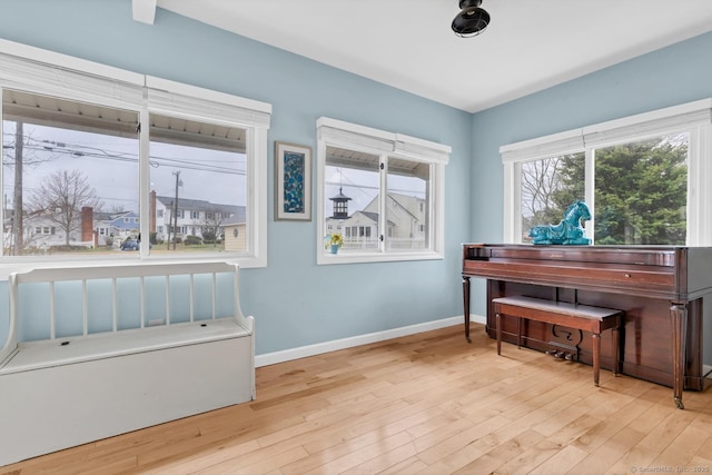 37 Woodland Dr, Old Saybrook, CT 06475 - living area with wood finished floors, baseboards, and plenty of natural light