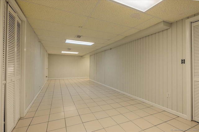 spare room with a paneled ceiling
