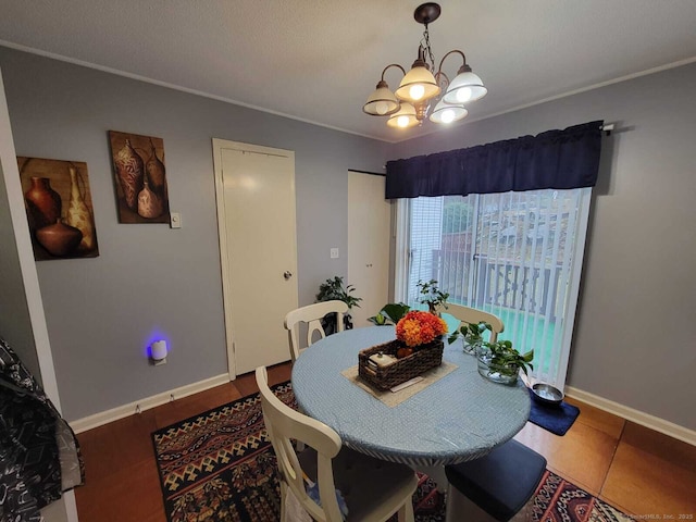 24 Deerwood Ln Unit 3, Waterbury, CT 06704 - dining room with baseboards, a chandelier, and crown molding