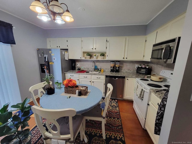 24 Deerwood Ln Unit 3, Waterbury, CT 06704 - kitchen with a sink, open shelves, white cabinetry, stainless steel appliances, and an inviting chandelier