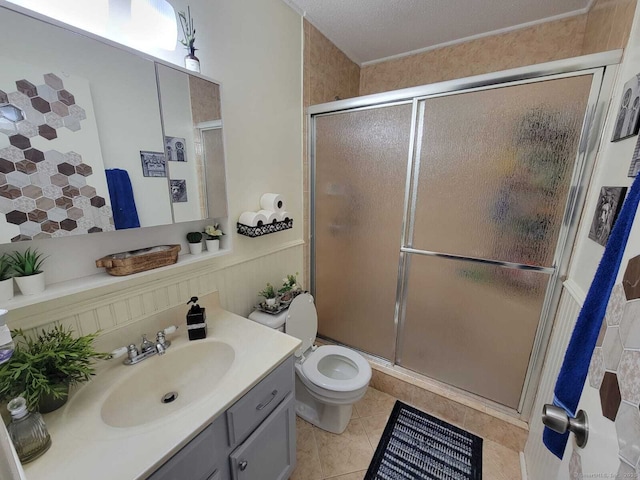 24 Deerwood Ln Unit 3, Waterbury, CT 06704 - full bathroom featuring toilet, a stall shower, tile patterned flooring, and vanity