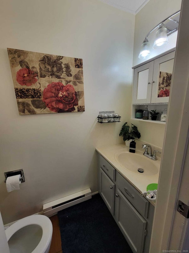 24 Deerwood Ln Unit 3, Waterbury, CT 06704 - bathroom with toilet, vanity, and a baseboard radiator
