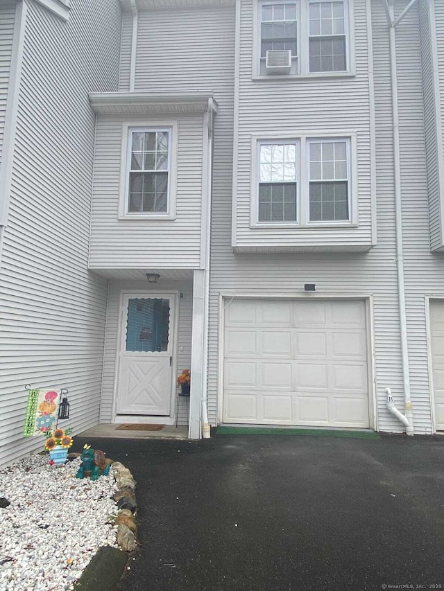 24 Deerwood Ln Unit 3, Waterbury, CT 06704 - view of front of home featuring aphalt driveway and a garage