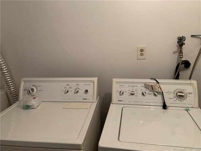 laundry room featuring washer and dryer and laundry area