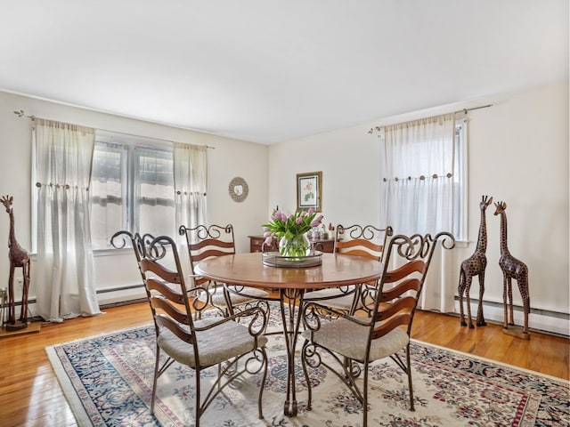 48 Meyer Pl, Greenwich, CT 06878 - dining space featuring a baseboard radiator, light wood-style floors, and a baseboard heating unit