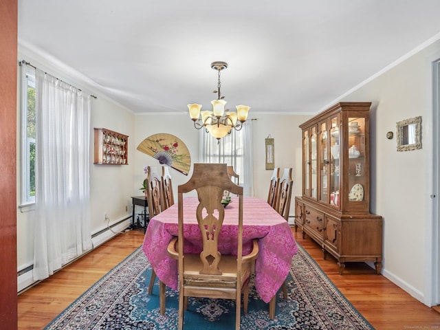 48 Meyer Pl, Greenwich, CT 06878 - dining space with baseboard heating, light wood-type flooring, baseboards, ornamental molding, and an inviting chandelier