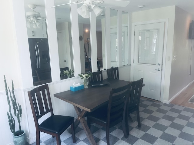 dining room with tile patterned floors and a ceiling fan
