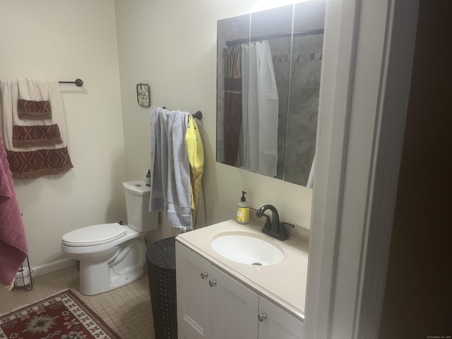 bathroom with toilet, tile patterned floors, curtained shower, and vanity