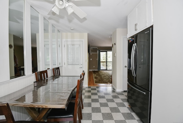 23 Hart Pl Apt 3, Plainville, CT 06062 - dining space featuring dark flooring, a wall unit AC, a ceiling fan, and baseboards