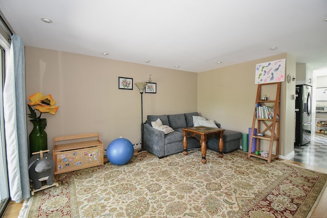 23 Hart Pl Apt 3, Plainville, CT 06062 - living area featuring recessed lighting, a baseboard radiator, and wood finished floors