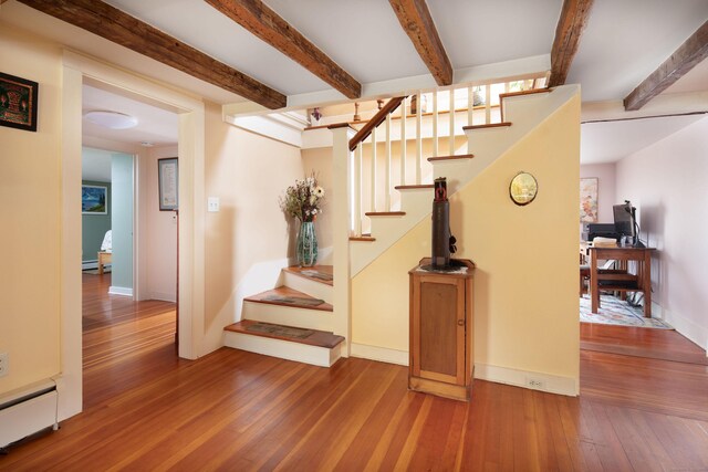 2 Perry St, Salisbury, CT 06039 - stairway featuring baseboard heating, hardwood / wood-style floors, beam ceiling, and baseboards