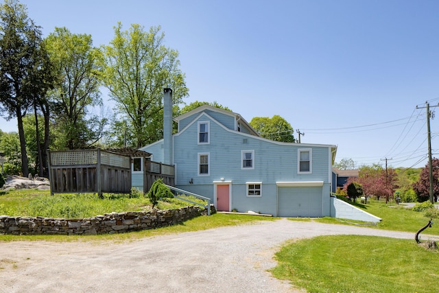 2 Perry St, Salisbury, CT 06039 - rear view of property with a garage, dirt driveway, and a yard
