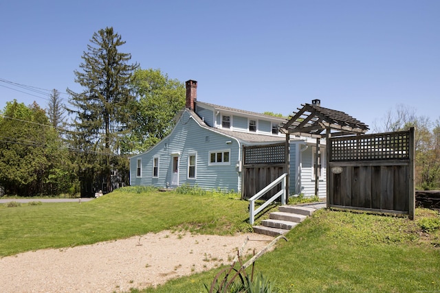 2 Perry St, Salisbury, CT 06039 - rear view of property with a chimney, a yard, and a pergola