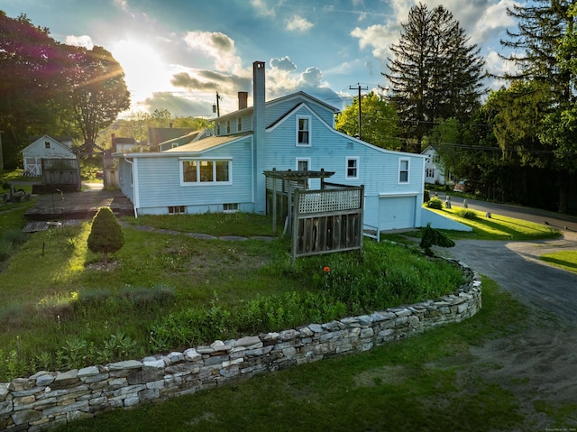 2 Perry St, Salisbury, CT 06039 - rear view of house with an attached garage, asphalt driveway, and a chimney