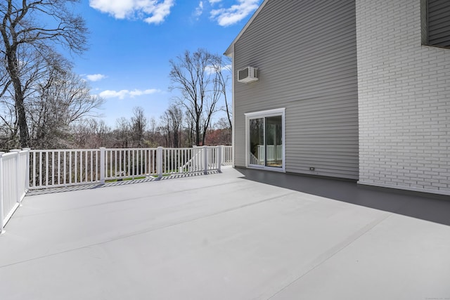 view of patio / terrace with a wall mounted air conditioner
