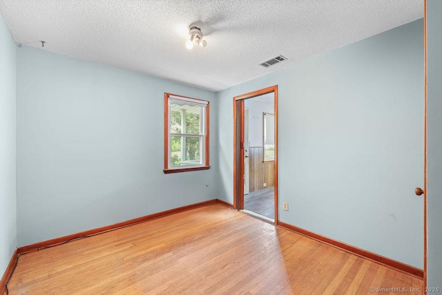 287 Prospect St, Wethersfield, CT 06109 - unfurnished bedroom featuring light wood-style floors, baseboards, and a textured ceiling