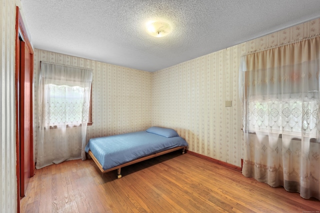 287 Prospect St, Wethersfield, CT 06109 - bedroom with hardwood / wood-style floors and a textured ceiling