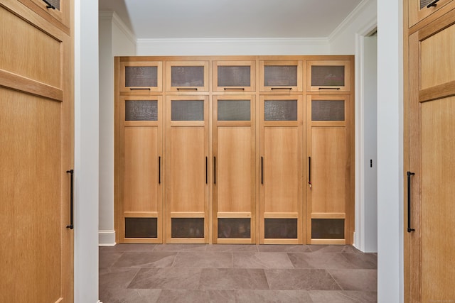 mudroom featuring ornamental molding