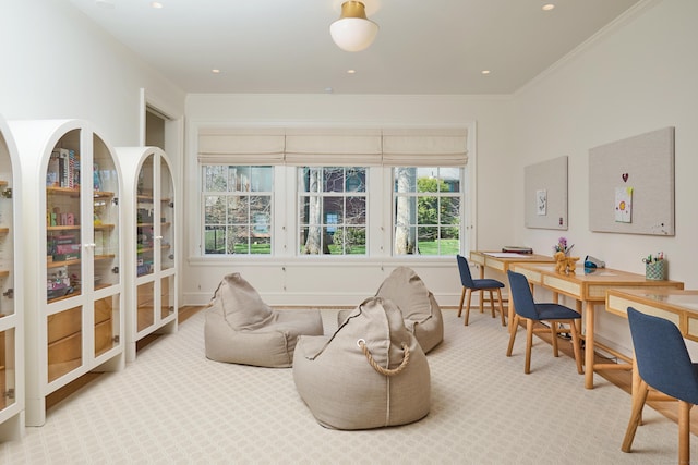 interior space with ornamental molding, carpet flooring, and baseboards
