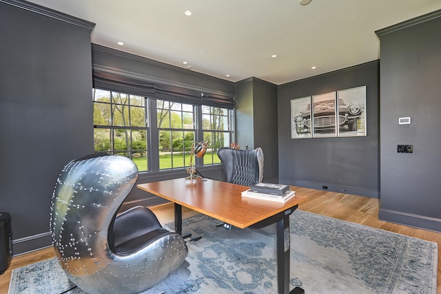 office space featuring wood finished floors, baseboards, ornamental molding, and recessed lighting