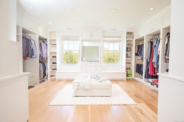 spacious closet featuring light wood-style flooring