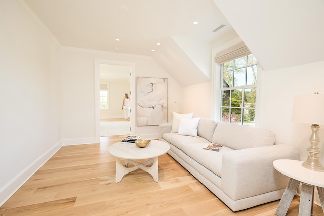 living area with lofted ceiling, light wood-type flooring, visible vents, recessed lighting, and baseboards