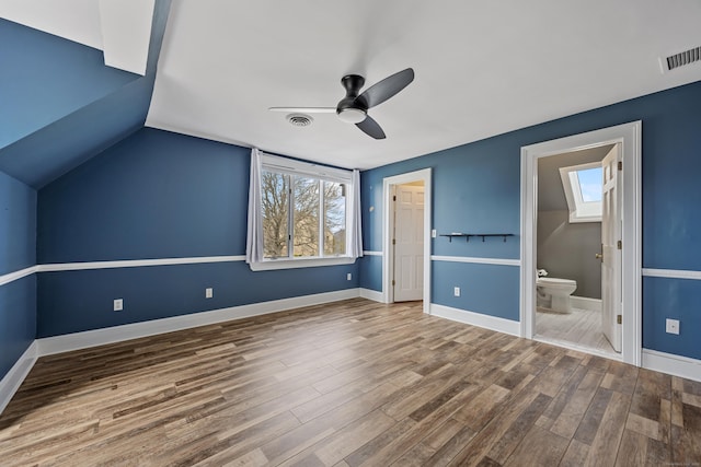 14 Turnberry Rd, Wallingford, CT 06492 - unfurnished bedroom featuring wood finished floors, ensuite bathroom, baseboards, lofted ceiling, and ceiling fan
