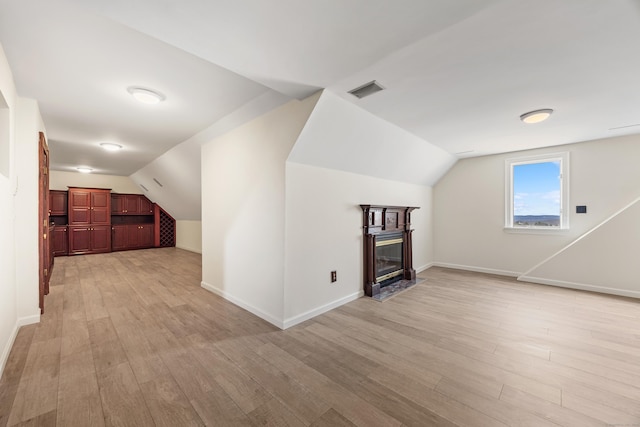 14 Turnberry Rd, Wallingford, CT 06492 - additional living space featuring vaulted ceiling, light wood-style flooring, and baseboards