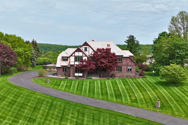 14 Turnberry Rd, Wallingford, CT 06492 - back of property with a yard, brick siding, and a view of trees