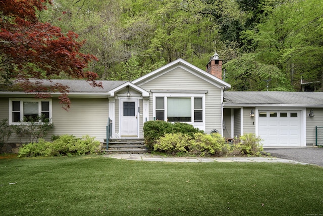128 S Kent Rd, Kent, CT 06785 - ranch-style house with aphalt driveway, an attached garage, a front yard, a chimney, and a shingled roof