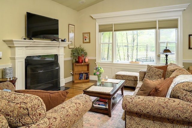 128 S Kent Rd, Kent, CT 06785 - living area featuring lofted ceiling, a fireplace, and wood finished floors
